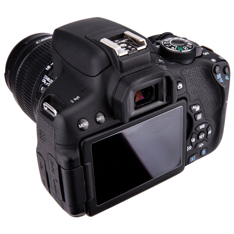 Back view of a black DSLR camera on a white background